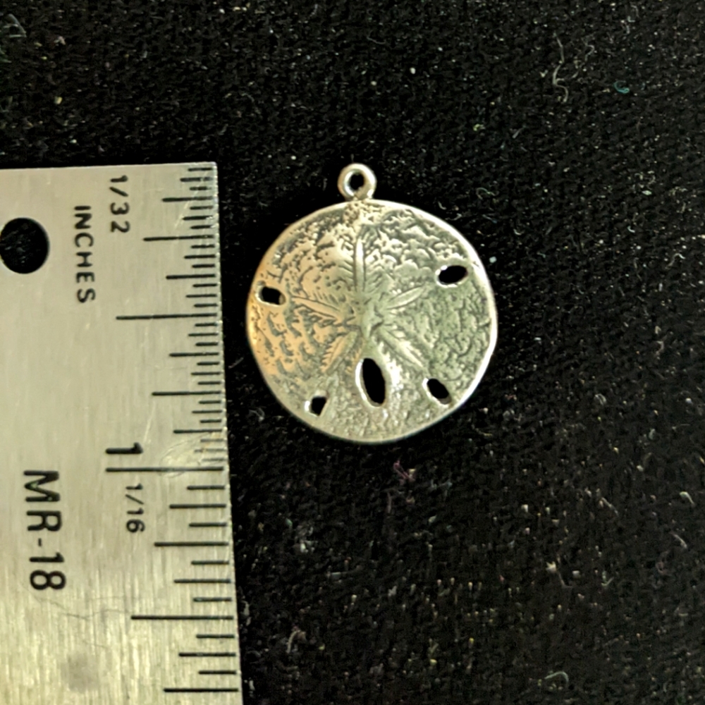 Sun West silver sand dollar charm